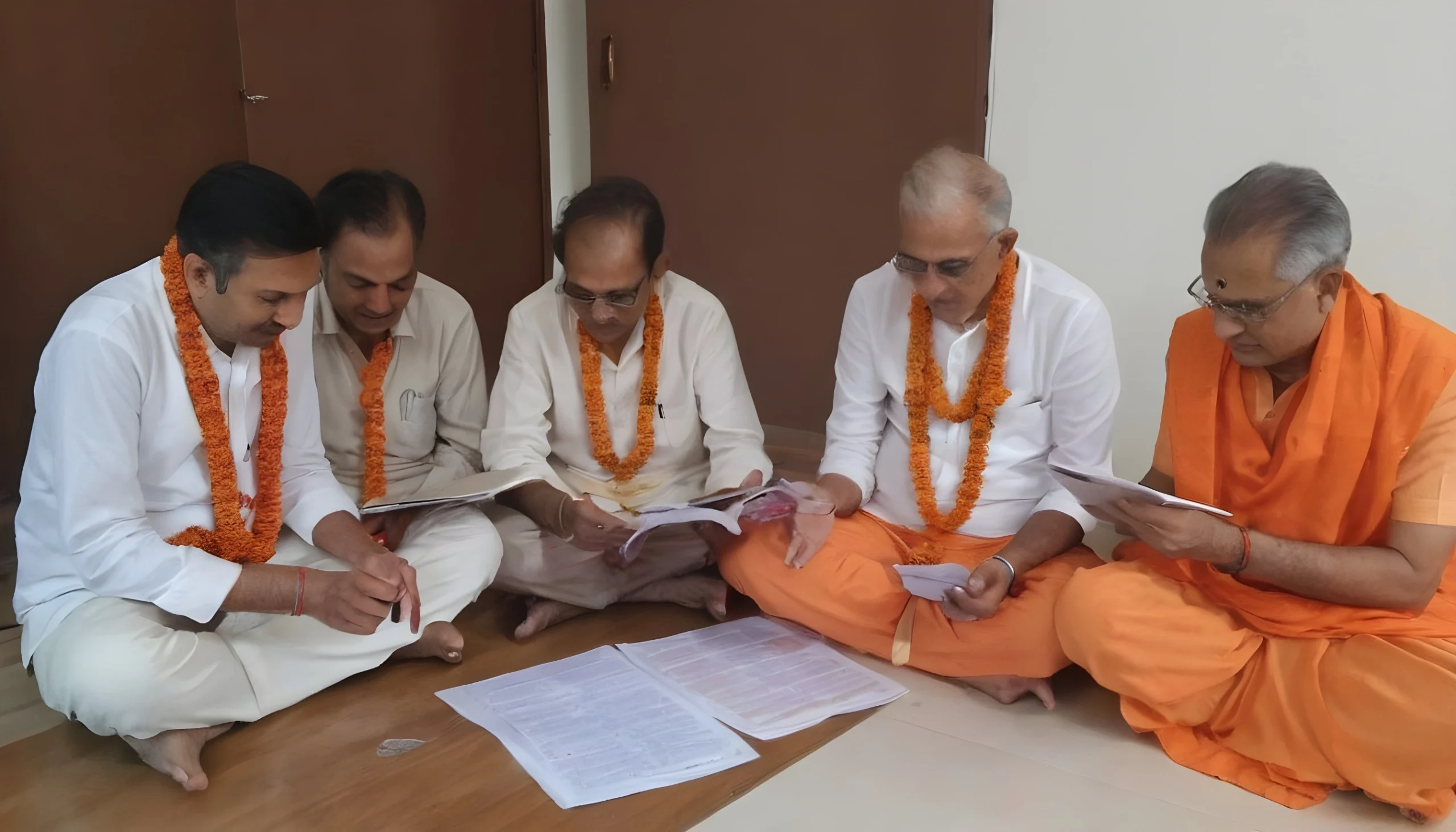 group-of-pandit-working-together-on-kundli-upscaled